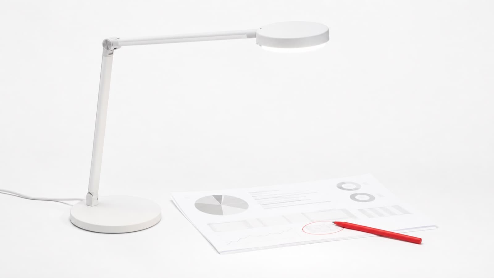 Desk lamp lighting an escape room ad account under a 27-point review